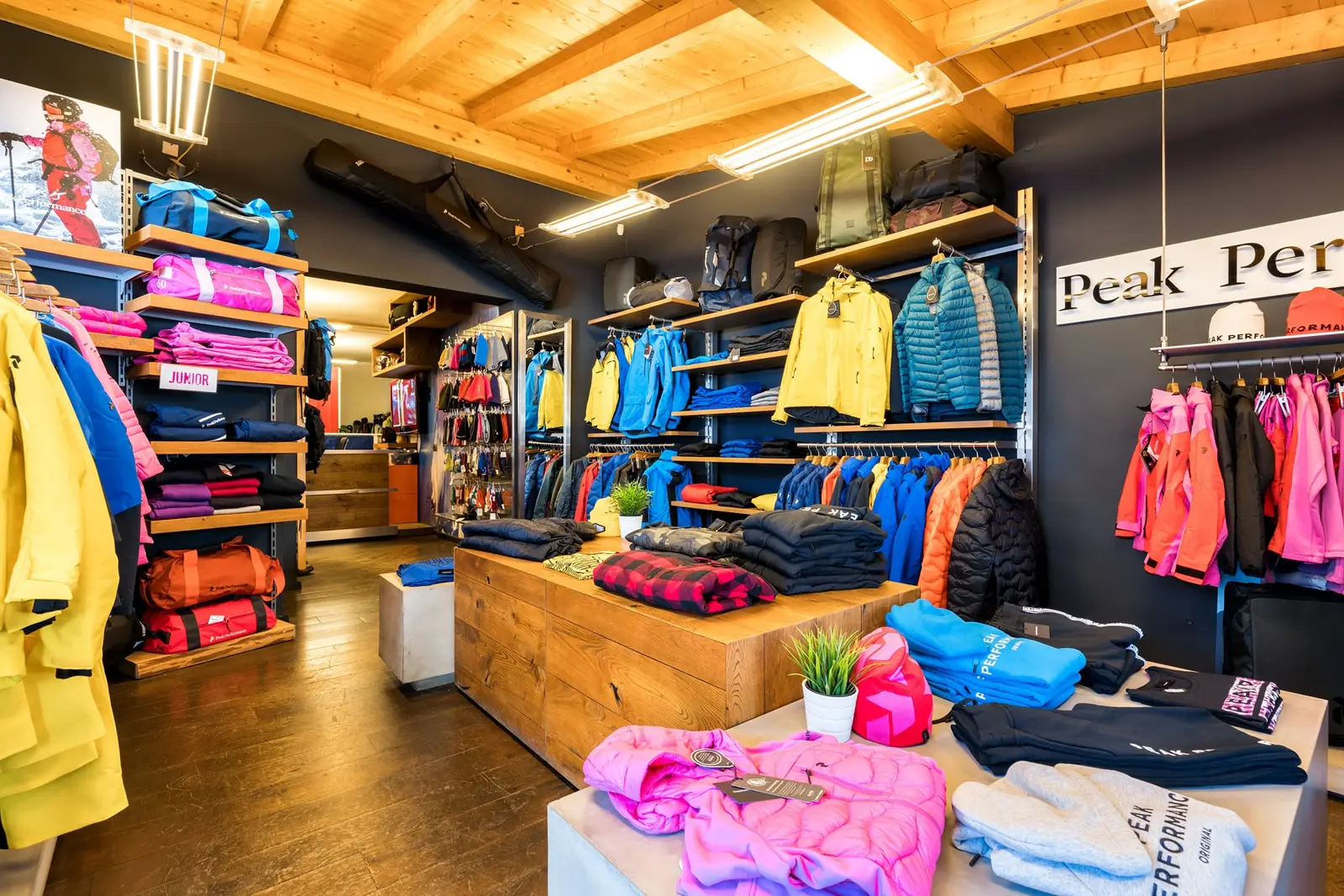 Shop interior with the Peak Performance wall and colourful jackets
